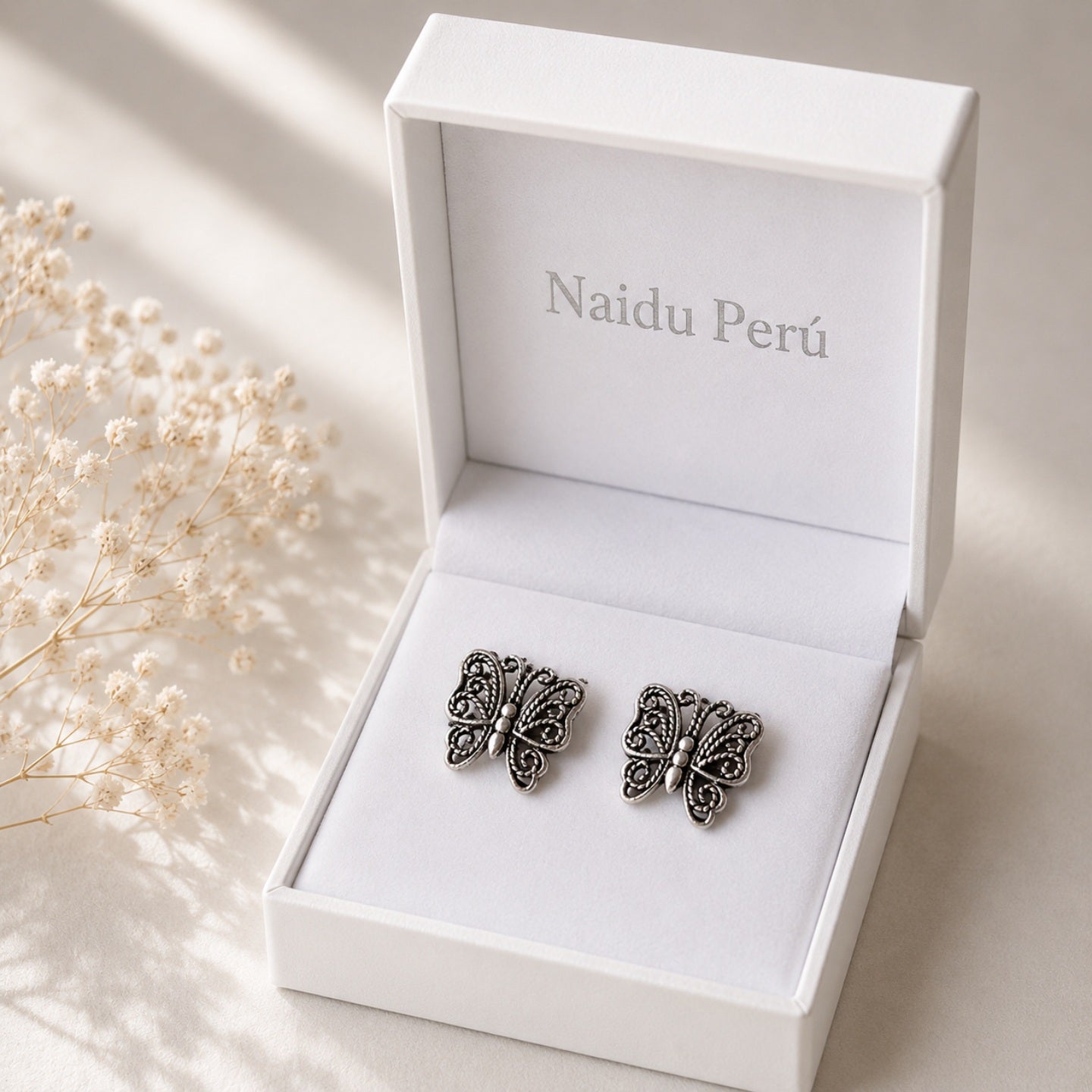 Aretes mariposa tejida